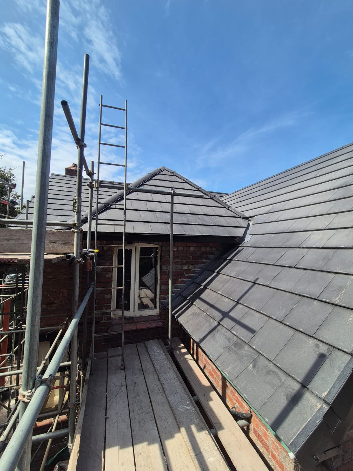Hip detail on the new roof with scaffold access