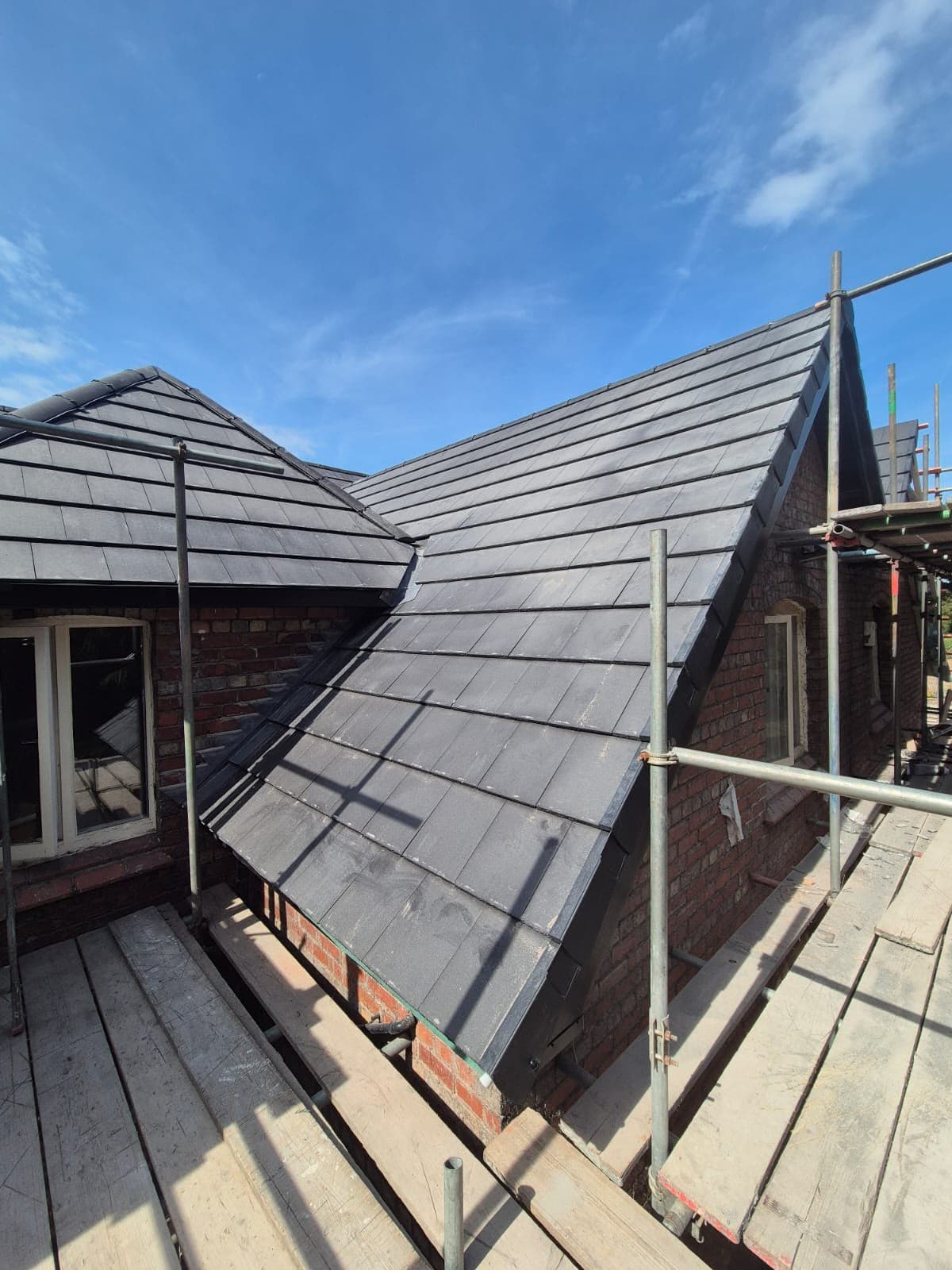 Completed re-roof in Lower Heswall, wide view of the hips and valleys