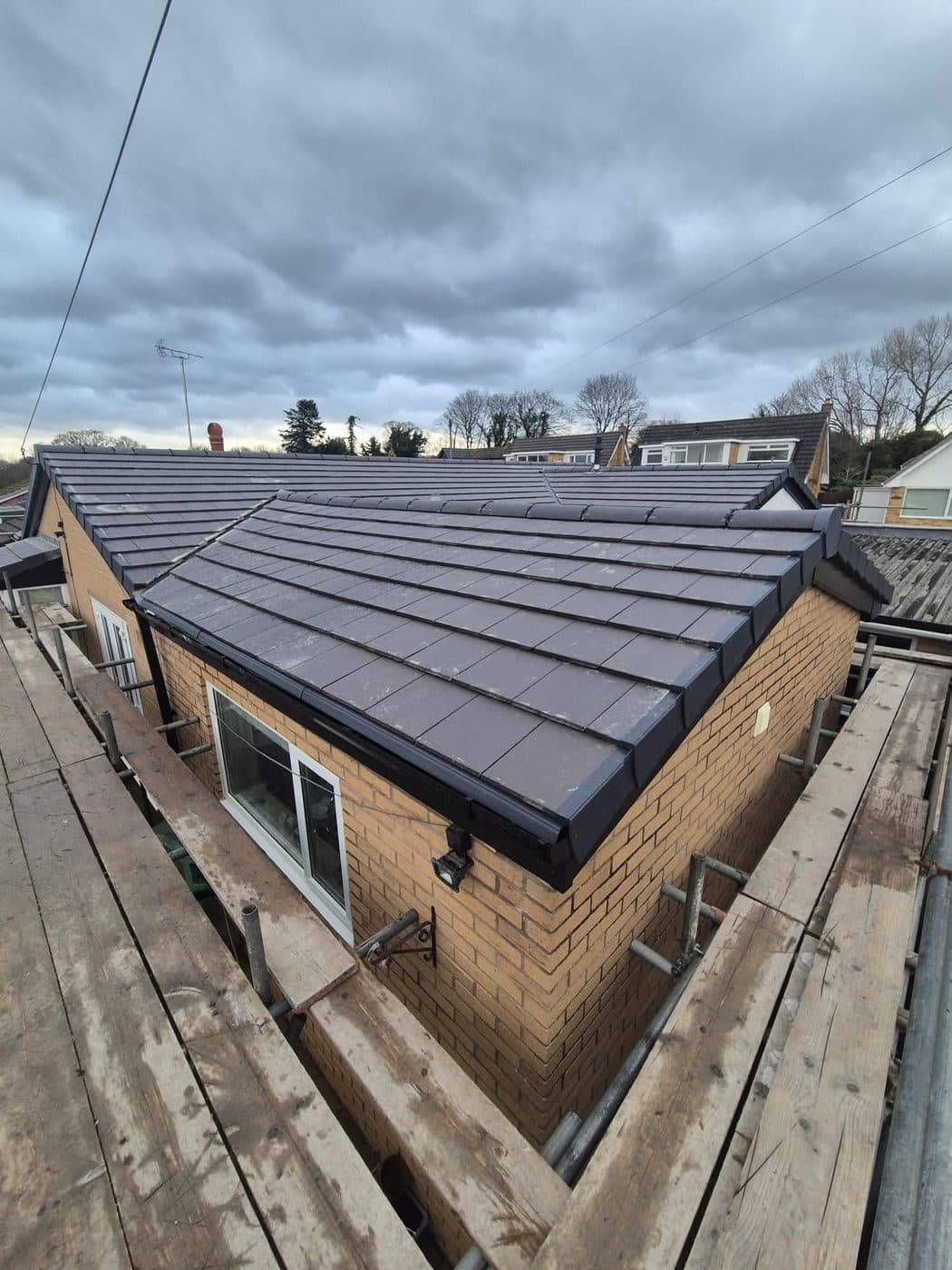Finished hip line and new guttering on a bungalow re-roof, Parkgate